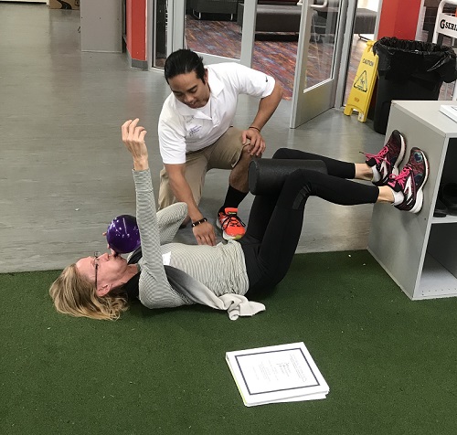 This is an image of me teaching a 90/90 Hip Lift at a course I was helping with in California.